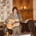 Ken playing guitar in 1982